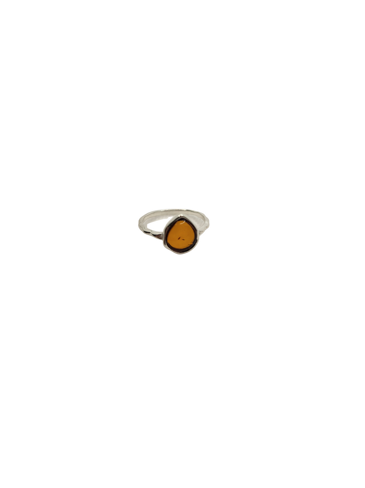 Indulge in the opulence of our sterling silver ring, adorned with a rare 8.8mm x 7.9mm pear-shaped Baltic amber from Poland. The band boasts a delicately hammered texture, adding a touch of sophistication to any outfit. Available in sizes 5-9, this piece is a must-have for the discerning connoisseur. Complete your ensemble by pairing it with our other sterling silver and Baltic amber jewelry pieces.