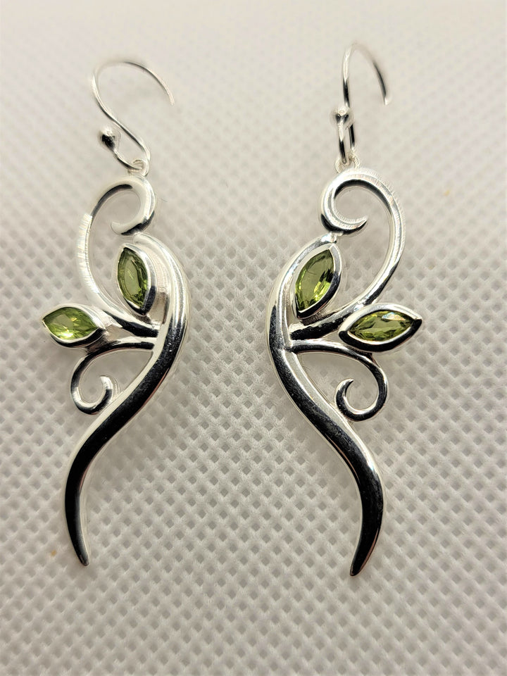 Prepare to make a statement with our exquisite sterling silver peridot leaf earrings. Mesmerizing beauty guaranteed.