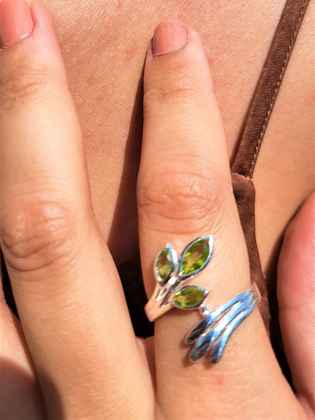 Introducing our stunning Sterling Silver Fan Wrap Ring with three exquisite marquise peridots. Embrace elegance today!