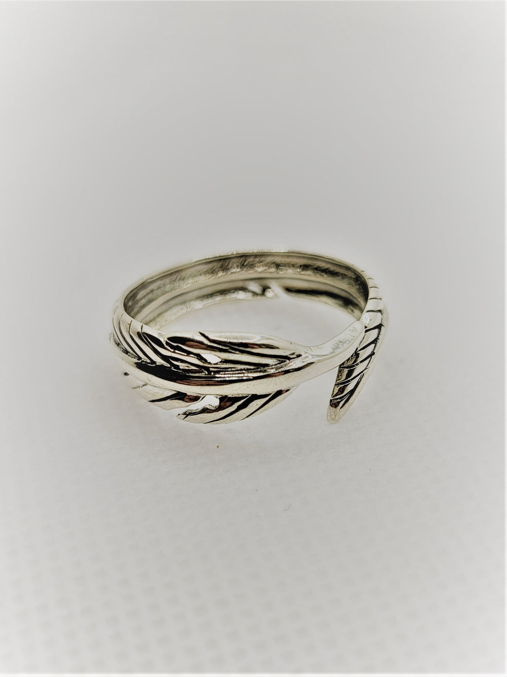 Introducing our lavish oxidized sterling silver feather wrap band, meticulously handcrafted with .925 sterling silver.