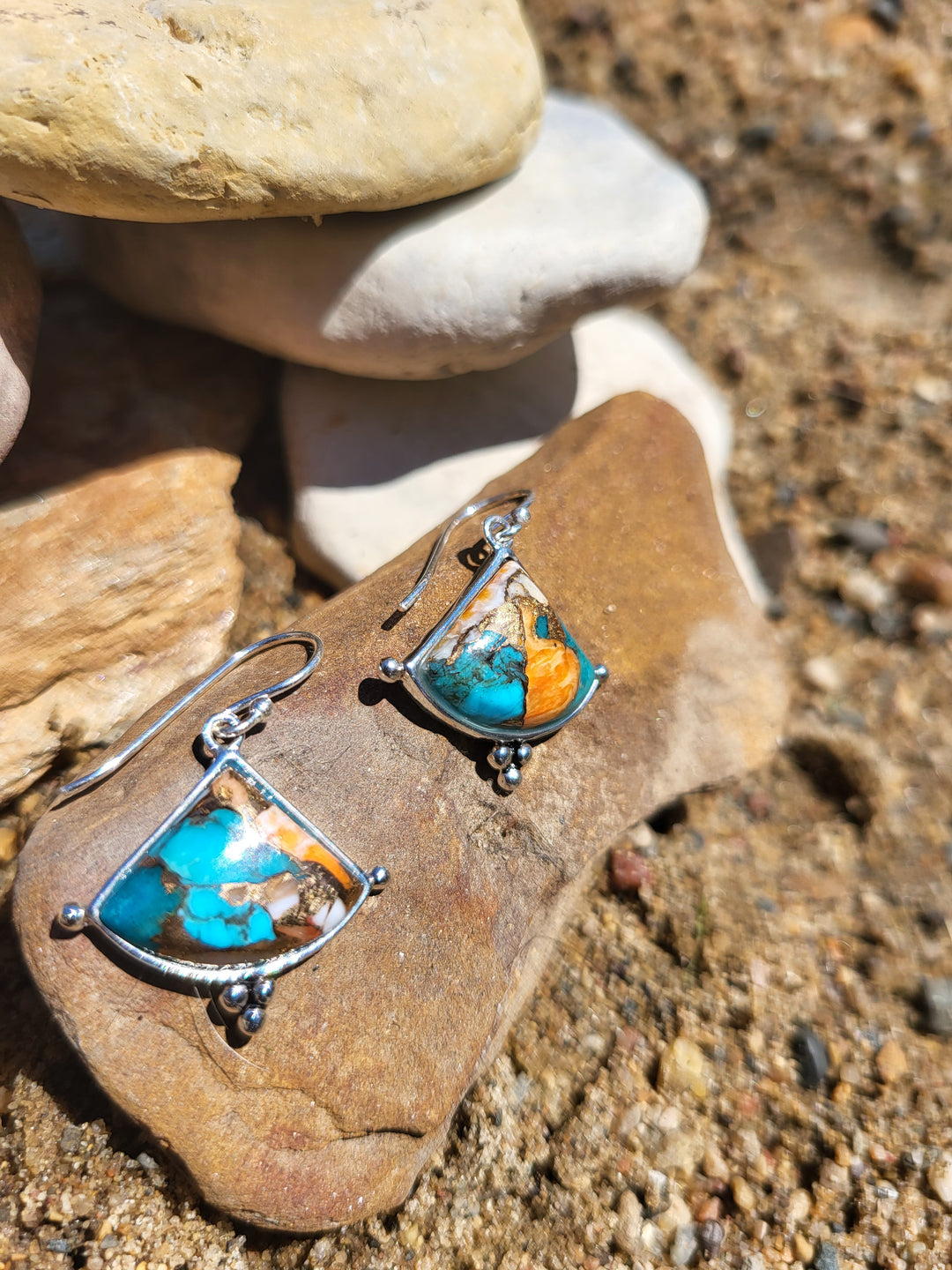 These earrings are a versatile piece that can be worn by any fashion discerning woman, adding a touch of glamour and sophistication to any outfit. For a truly luxurious look, pair these earrings with any of our turquoise and spiny oyster jewelry collection pieces.