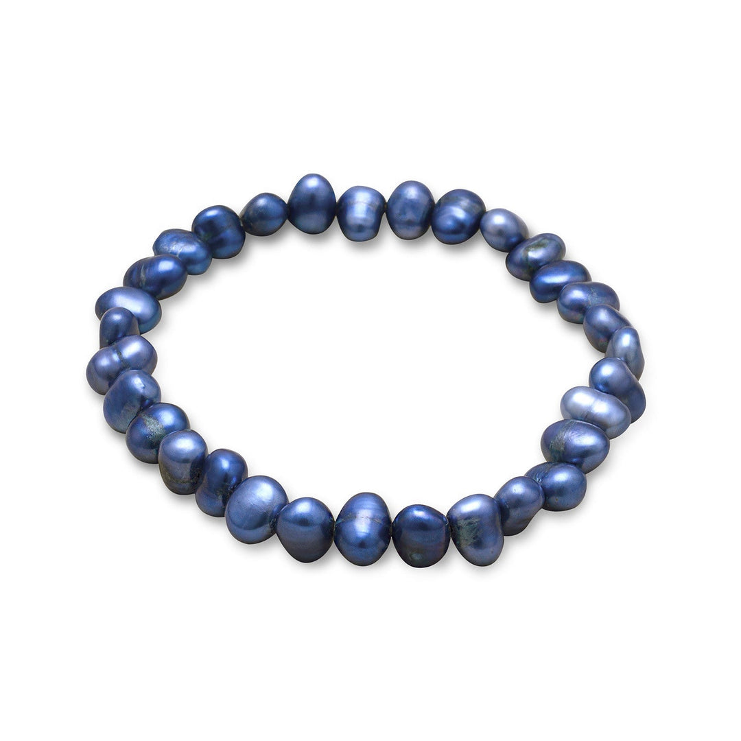 Introducing our exquisite 7" dyed dark blue cultured freshwater pearl stretch bracelet, a stunning addition to any jewelry collection. Each pearl is carefully selected for its exceptional quality and measures approximately 5-6mm in size, ensuring a uniform and elegant appearance. The stretch design allows for easy and comfortable wear, while the deep blue hue of the pearls adds a touch of sophistication to any outfit.