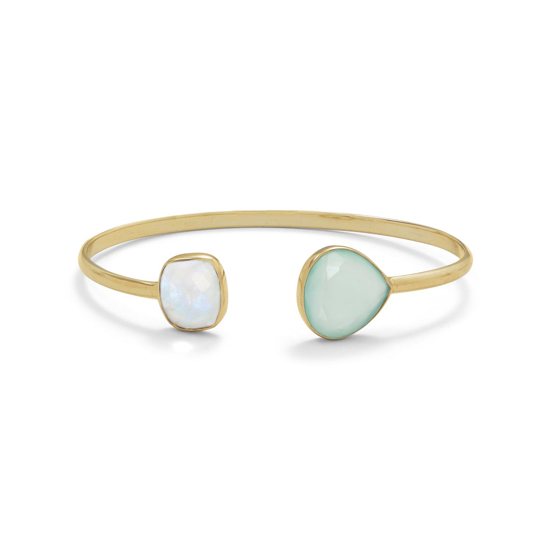 14 karat gold plated sterling silver 3mm wide cuff bracelet featuring a 12mm x 11mm bezel set faceted rainbow moonstone on one end of the split and a 15mm x 15mm bezel set faceted green chalcedony pear shape on the opposite end of the split. This cuff is slightly adjustable to fit most wrists. .925 Sterling Silver