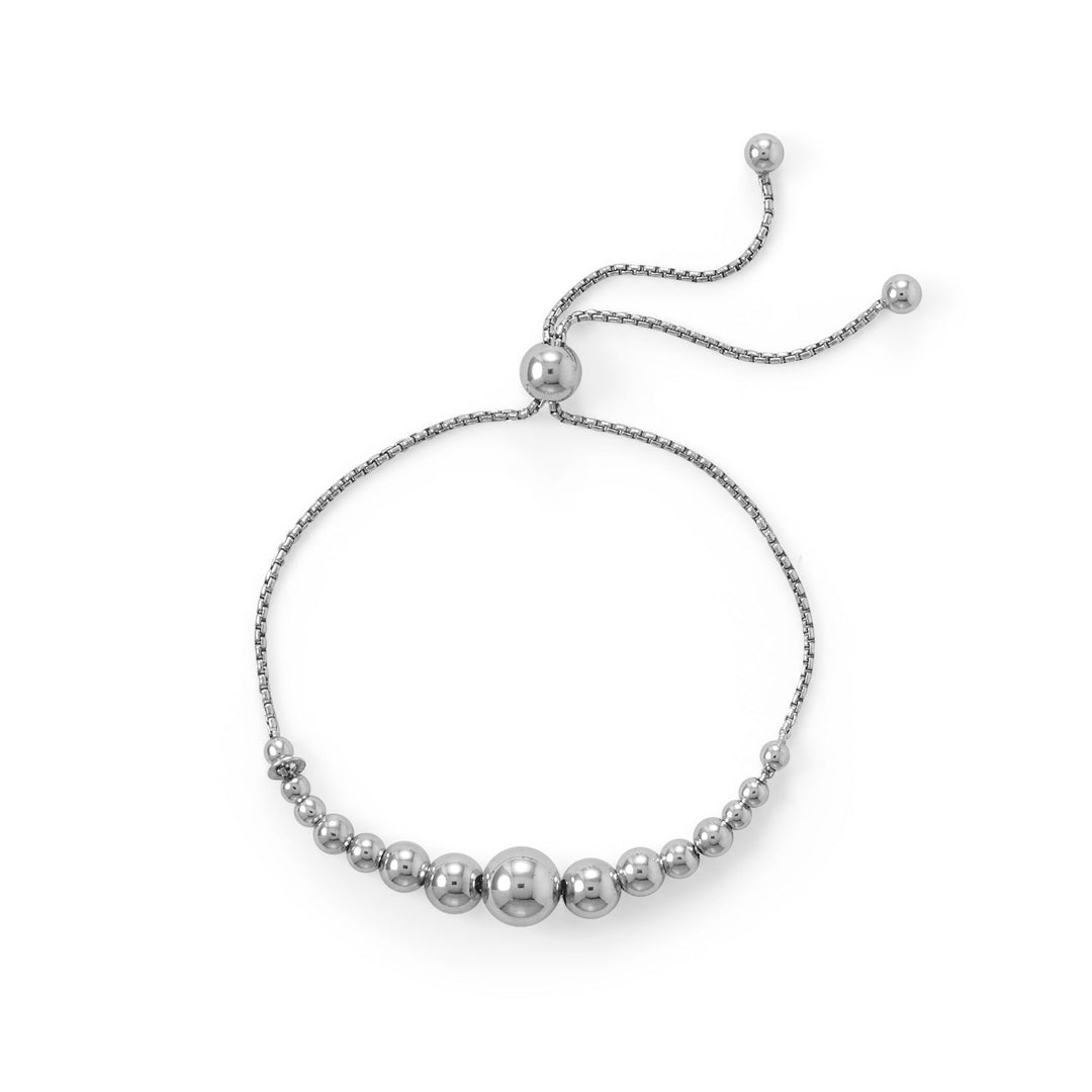 Indulge in the exquisite craftsmanship of our Italian-made adjustable rhodium plated sterling silver friendship bolo bracelet. Featuring a graduating bead from 8mm to 3mm on a 1.2mm rounded box chain, it adjusts up to 9" with a 6.1mm stopper bead and is finished with 4mm bead ends. A fabulous gift to give to a loved one.