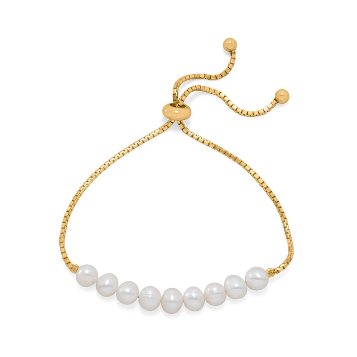 Indulge in luxury with our adjustable 14k gold plated sterling silver bolo bracelet, adorned with 9 white cultured freshwater pearls. Valuable and versatile, it pairs perfectly with our gold and pearl collection.