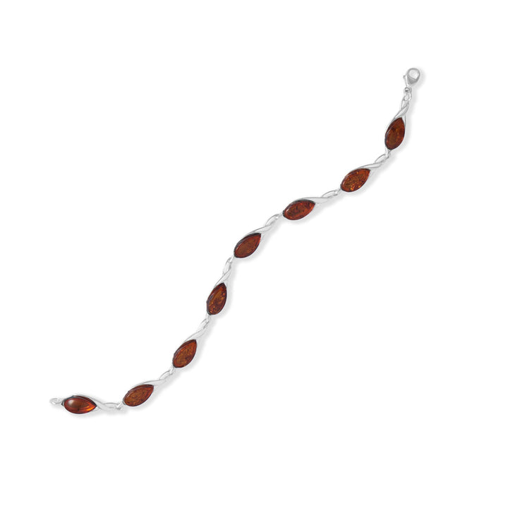 Introducing our exquisite 7" sterling silver cutout bracelet, adorned with 5.5mm x 10.6mm pear-shaped Baltic amber from Poland. Its timeless elegance and lobster clasp closure ensure both beauty and safety. Pair it with our stunning Baltic amber collection for an enchanting allure.