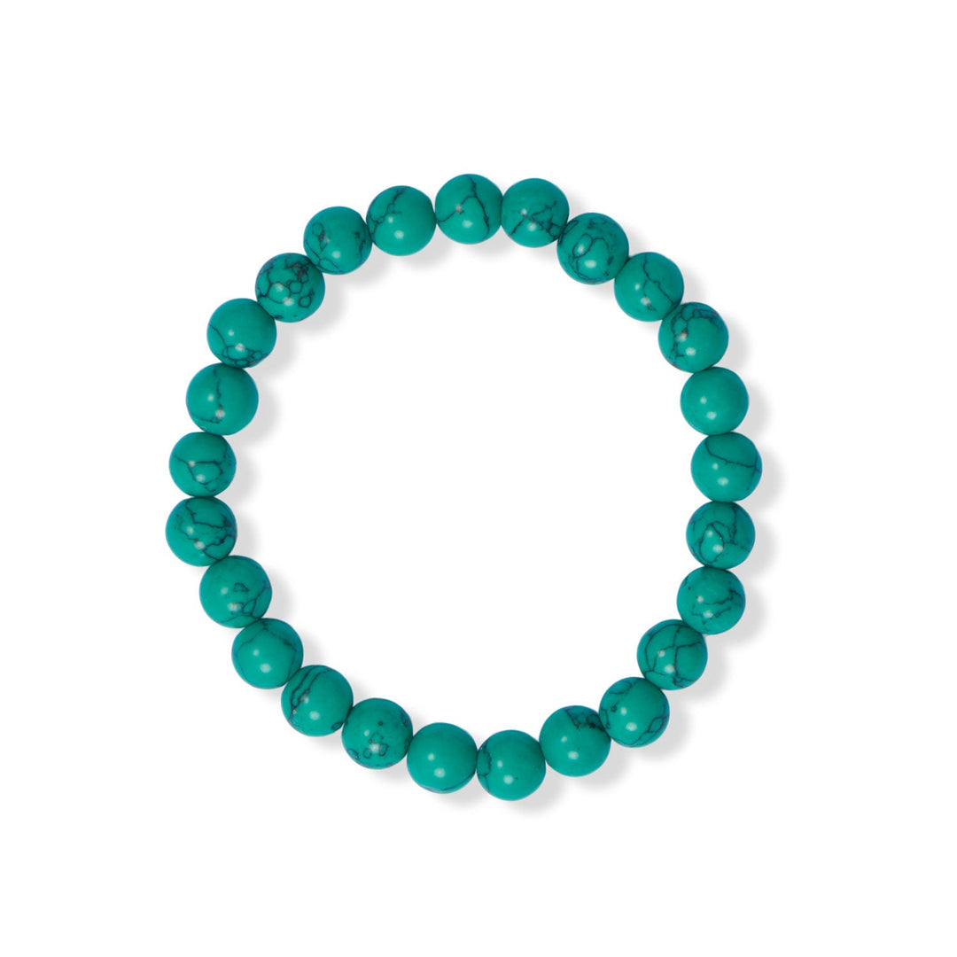 Introducing the 8mm dyed green howlite bead stretch bracelet, a stunning addition to any jewelry collection. Howlite is a naturally occurring mineral that is often used in jewelry making due to its unique appearance and durability. In order to achieve the vibrant green hue of these beads, a dyeing process is employed, resulting in a striking color that is reminiscent of turquoise with black grain accents.