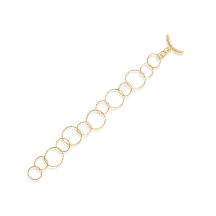 Introducing our exquisite 8" gold plated toggle bracelet. Crafted with precision, its alternating textured links exude elegance. Adjustable for a perfect fit, it effortlessly captivates onlookers. Pair it with our stunning gold circle link jewelry for a truly mesmerizing ensemble.