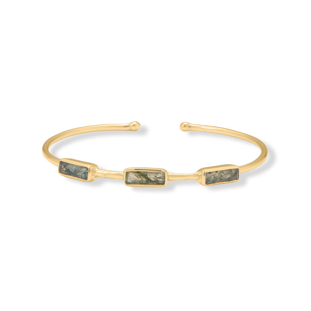 Introducing our exquisite cuff bracelet, crafted from .925 sterling silver and 14 karat gold plating. Adorned with stunning 10mm x 3mm baguette cut moss agate stones, each with a unique variegated appearance. This piece brings balance and stability, while its adjustable cuff design ensures a perfect fit. A true luxury statement, combining the value and beauty of precious metals and gemstones.