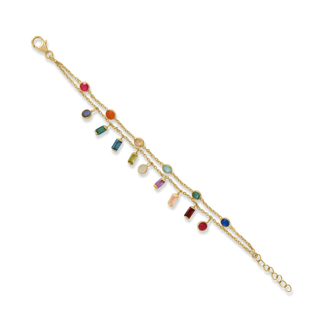 Confetti bracelet ~ festive and fun! 6" + 1" 14 karat gold plated sterling silver double strand bracelet features 4mm round and 3mm x 5mm baguette stone charms. Charms are dyed pink jade, carnelian, citrine, aqua glass, green glass, dyed blue jade, labradorite, green glass, blue glass, peridot, rainbow moonstone, amethyst, peach moonstone and garnet. Bracelet is finished with a lobster clasp closure. Please note stones may vary. .925 Sterling Silver 