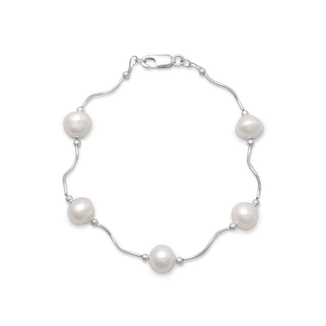 8" sterling silver wave design bracelet with 2.5mm sterling silver beads and 8.5mm cultured freshwater pearls. .925 Sterling Silver