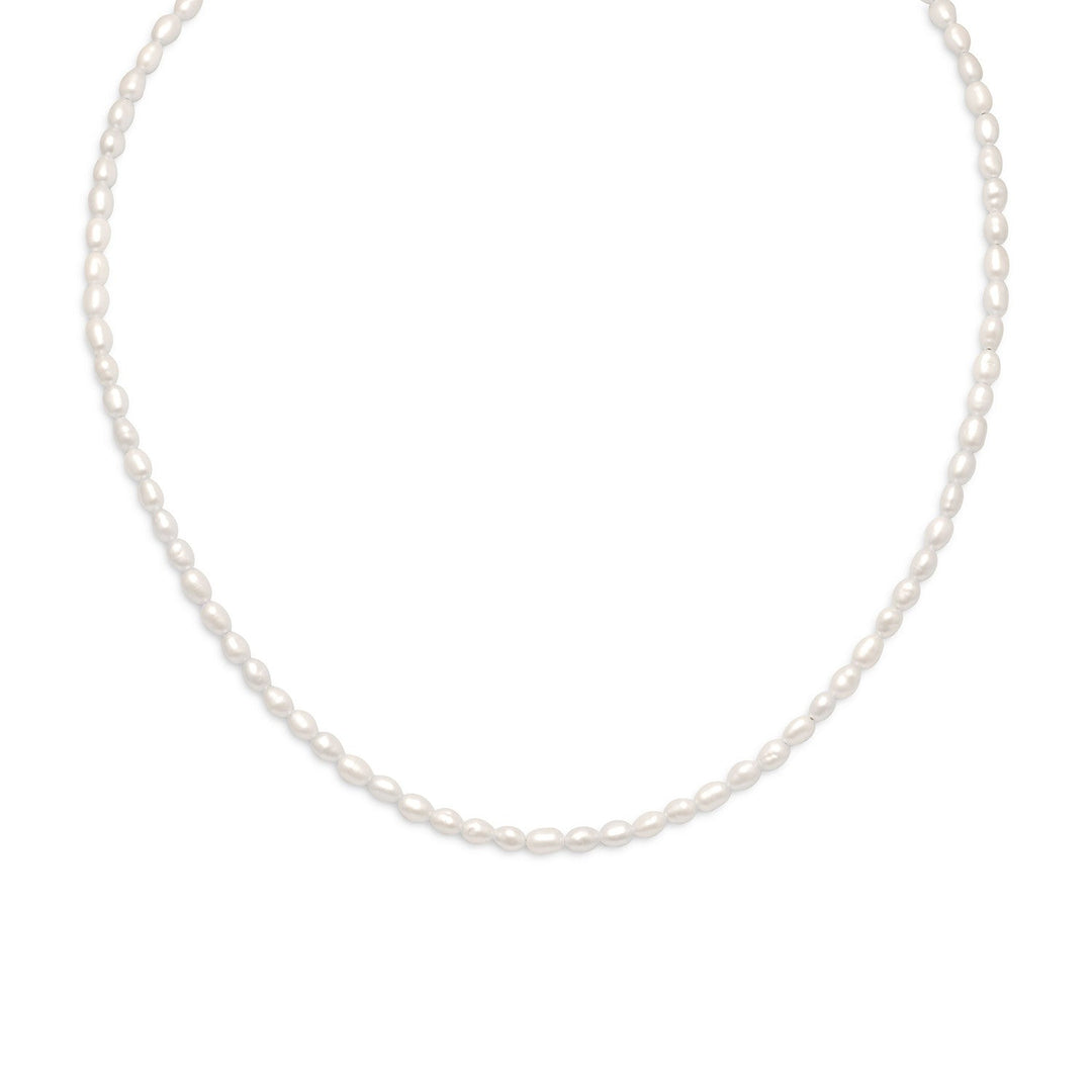 13" + 2" extension 14/20 gold filled cultured freshwater rice pearl necklace with approximately 3.5mm x 5mm white rice pearls. The necklace has a lobster clasp closure.