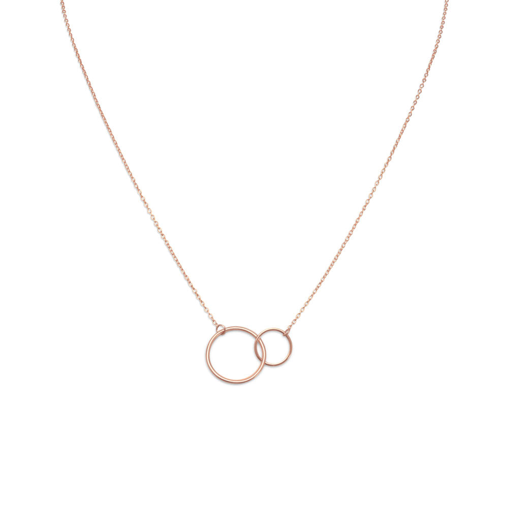 16" + 2" extension 14 karat rose gold plated sterling silver necklace with a small and large circle link center. The circles are approximately 10mm and 16mm. The necklace has a lobster clasp closure.