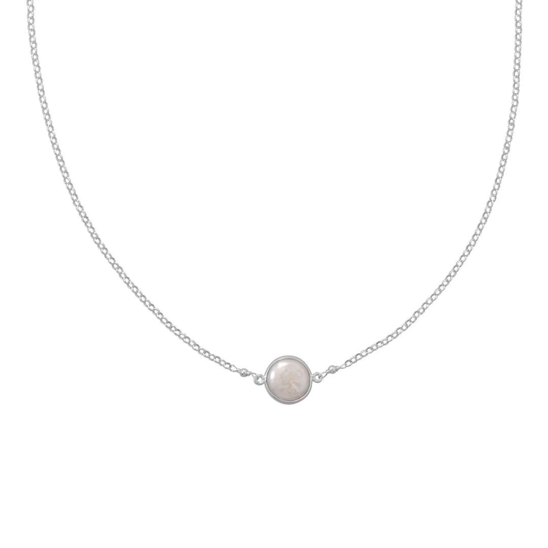 Sweet and simple!  16" sterling silver necklace features a cultured freshwater bezel coin pearl that measures approximately 14mm. Lobster clasp closure. .925 Sterling Silver