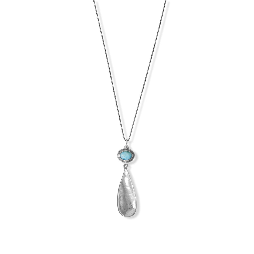 18" oxidized sterling silver necklace features a 6mm x 8mm larimar center stone with a hammered pear drop. Necklace is finished with a lobster clasp. .925 Sterling Silver 