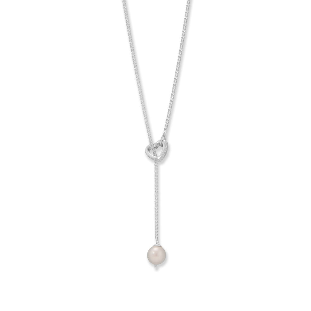 A simple statement. 16" + 2" sterling silver lariat necklace features a 6mm cultured freshwater pearl dropped through a tiny cubic zirconias outline heart. The cubic zirconias are 1.2mm, necklace is finished with a spring ring clasp closure.  