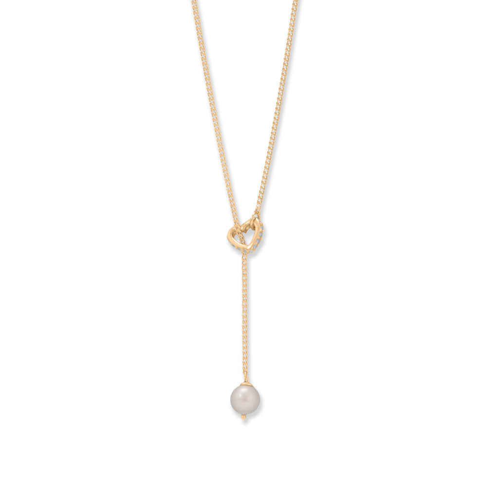 A simple statement. 16" + 2" 14k gold plated sterling silver lariat necklace features a 6mm cultured freshwater pearl dropped through a tiny Cubic Zirconia outline heart. The Cubic Zirconias are 1.2mm, necklace is finished with a spring ring clasp closure. 