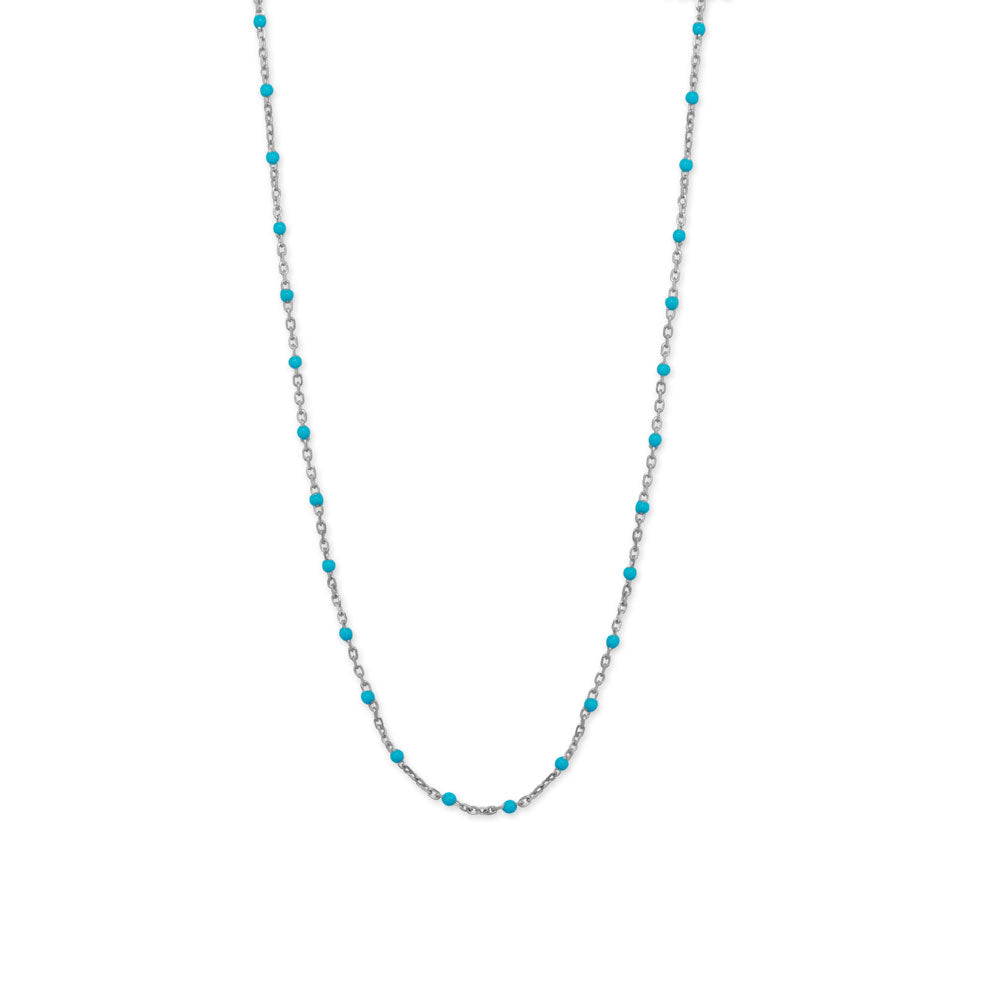 Indulge in the understated elegance of our Rhodium plated sterling silver satellite chain, featuring 2mm blue enamel beads. The bright, cheerful blue beads add a touch of luxury to any outfit. Finished with a lobster clasp, this .925 Sterling Silver piece is made in Italy.