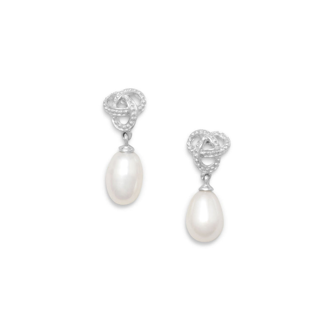 Introducing our exquisite Rhodium Plated Sterling Silver Love Knot Post Earrings with Cultured Freshwater Pearl Drop. These earrings are crafted from high-quality .925 Sterling Silver, ensuring durability and longevity. The cultured freshwater pearl drop measures 6mm, adding a touch of sophistication and elegance to the design.