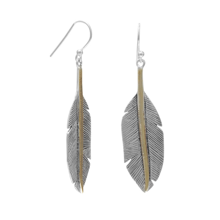 Introducing our opulent oxidized sterling silver feather drop earrings, adorned with 14 karat gold plated accents. Measuring 13mm x 55mm, these earrings exude elegance and sophistication. Pair them with our matching feather design jewelry for a truly lavish ensemble. Elevate your style and make a lasting impression with this exquisite treasure.