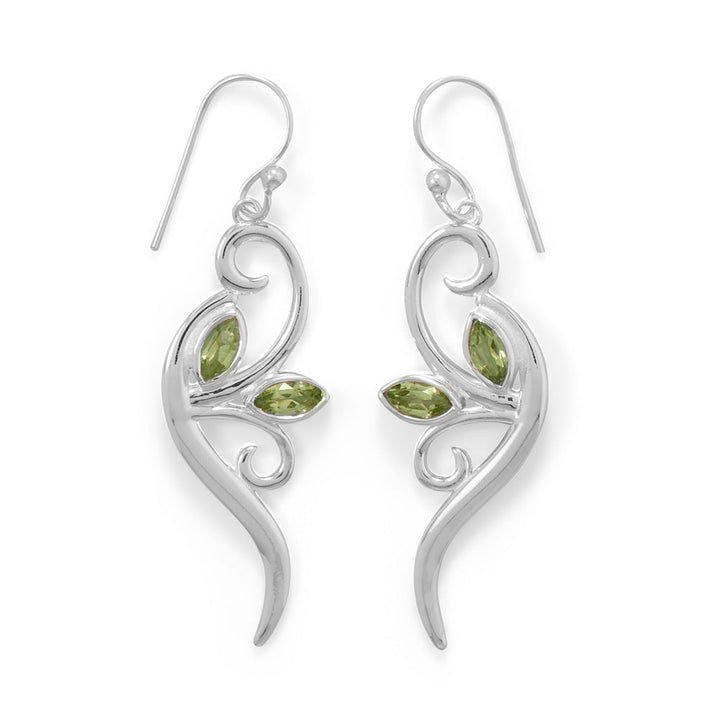 Get ready to turn heads with our chic and sophisticated sterling silver peridot leaf earrings. The beauty of the peridot against the polished silver is truly eye-catching. Measuring 14.5mm x 35.5mm, with a total hanging length of 49mm, these earrings are a must-have for the discerning connoisseur. Complete your ensemble by pairing them with our other sterling silver and peridot jewelry pieces. Elevate your style with the timeless elegance of these stunning earrings.