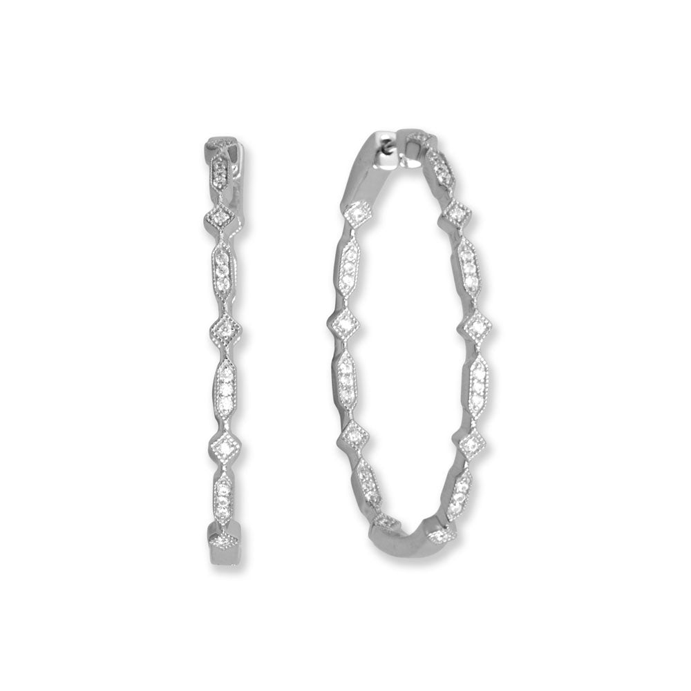 A new twist on the in/out Cubic Zirconia hoops! Rhodium-plated sterling silver in/out hoops have a diamond and elongated hexagon pattern with 1mm Cubic Zirconia details. Earrings have a click closure and are 44mm x 33.5mm. .925 Sterling Silver