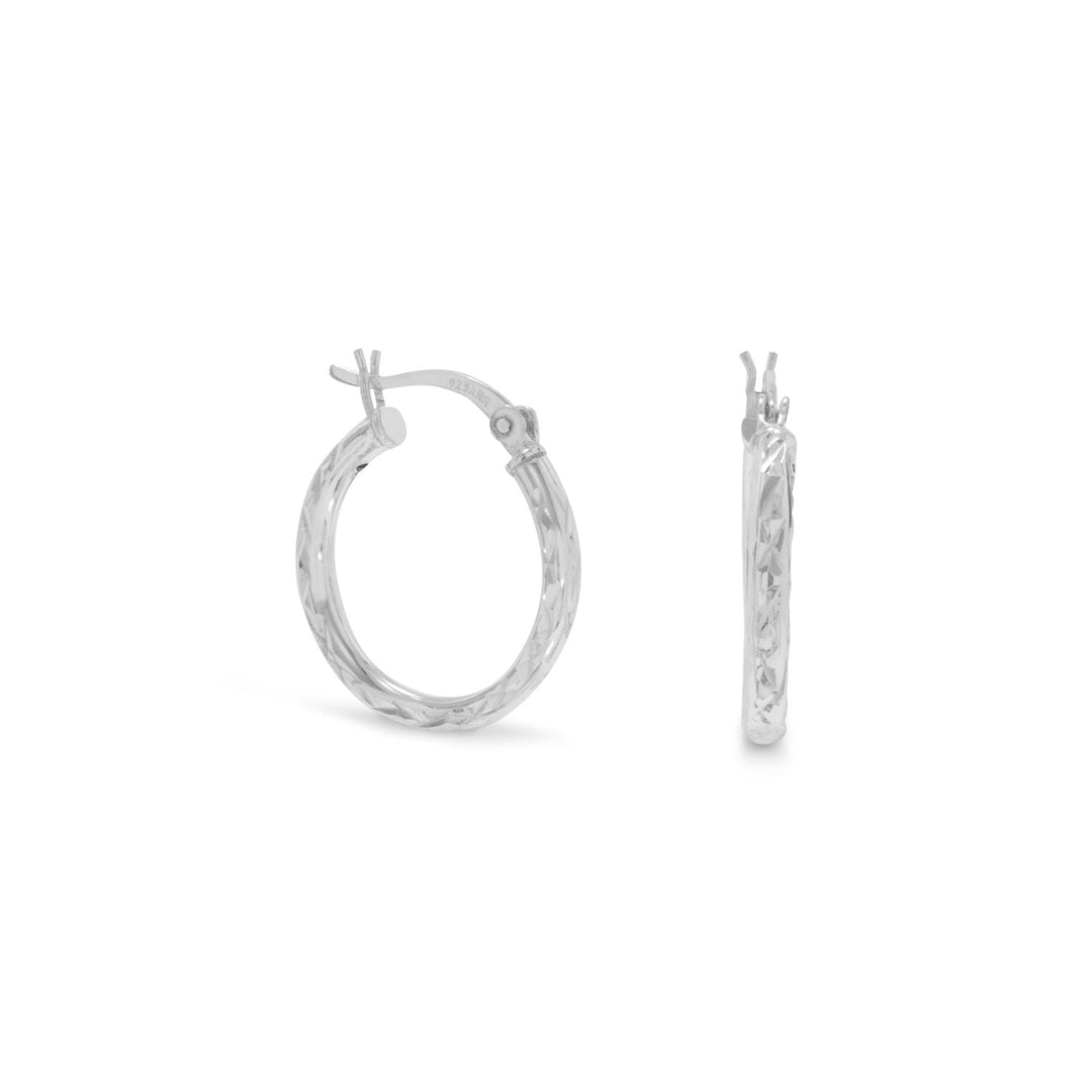 Our exquisite 2.5mm x 20mm diamond cut hoop earrings, crafted with utmost precision from .925 Sterling Silver. These stunning earrings are designed to elevate your style and add a touch of elegance to any outfit. The diamond cut detailing enhances the brilliance of the silver, creating a captivating sparkle that will surely catch everyone's attention. With their versatile size, these hoops are perfect for both casual and formal occasions, making them a must-have addition to your jewelry collection