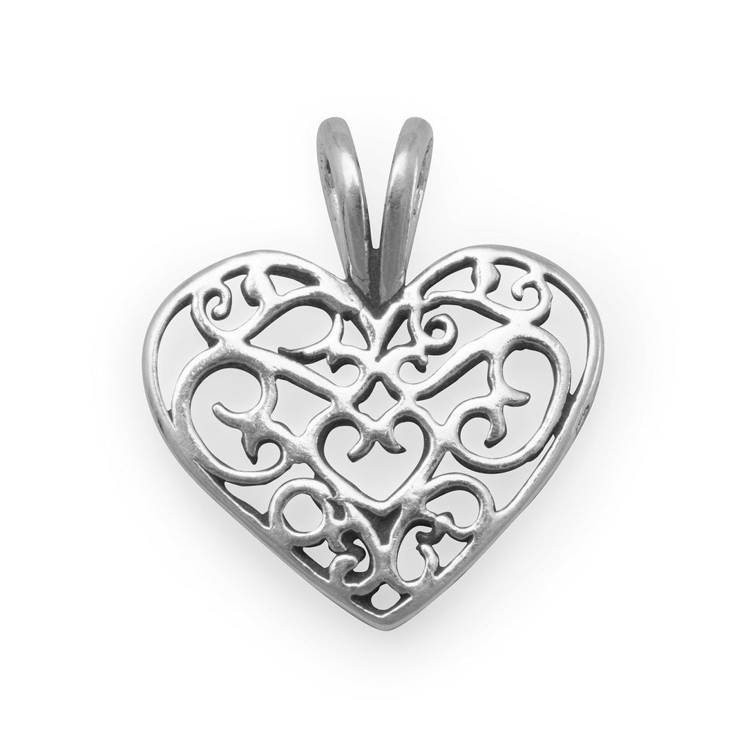 Introducing the exquisite Sterling Silver Filigree Heart Charm, a true masterpiece that will captivate your heart and elevate your style to new heights. Crafted with meticulous attention to detail, this charm boasts a diameter of 15mm, making it the perfect size to adorn any bracelet or necklace. Made from the finest .925 Sterling Silver, this charm exudes elegance and sophistication, ensuring that you stand out from the crowd with its timeless beauty.