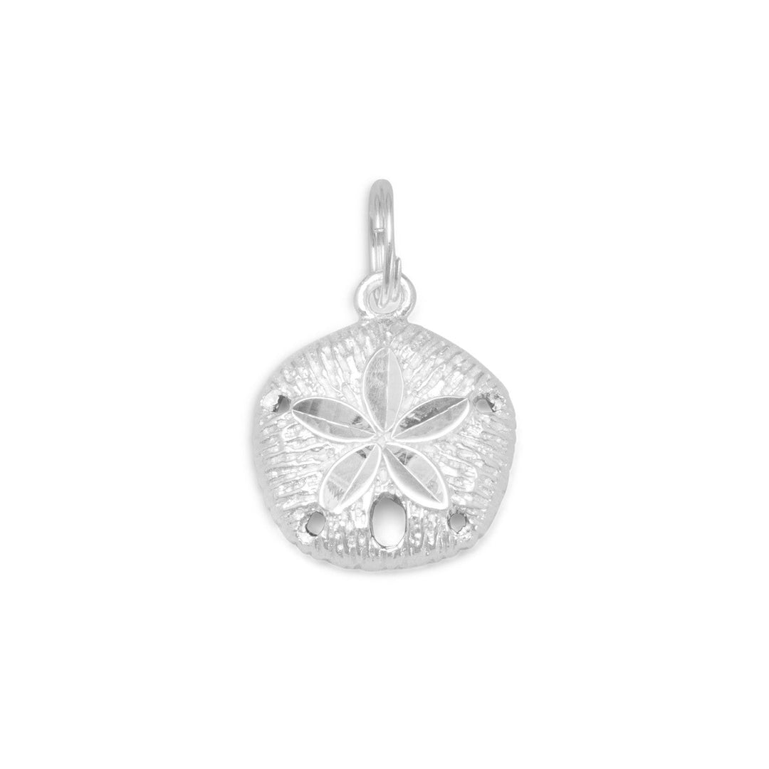 Introducing our exquisite Diamond Cut Sterling Silver 19mm x 13mm Sand Dollar Charm, crafted from premium .925 sterling silver. This stunning pendant boasts the beauty of a shimmery sand dollar, intricately designed to capture the essence of its natural form. This charming piece is designed to be worn with one of our beautiful sterling silver necklaces, adding a touch of elegance and sophistication to any outfit.