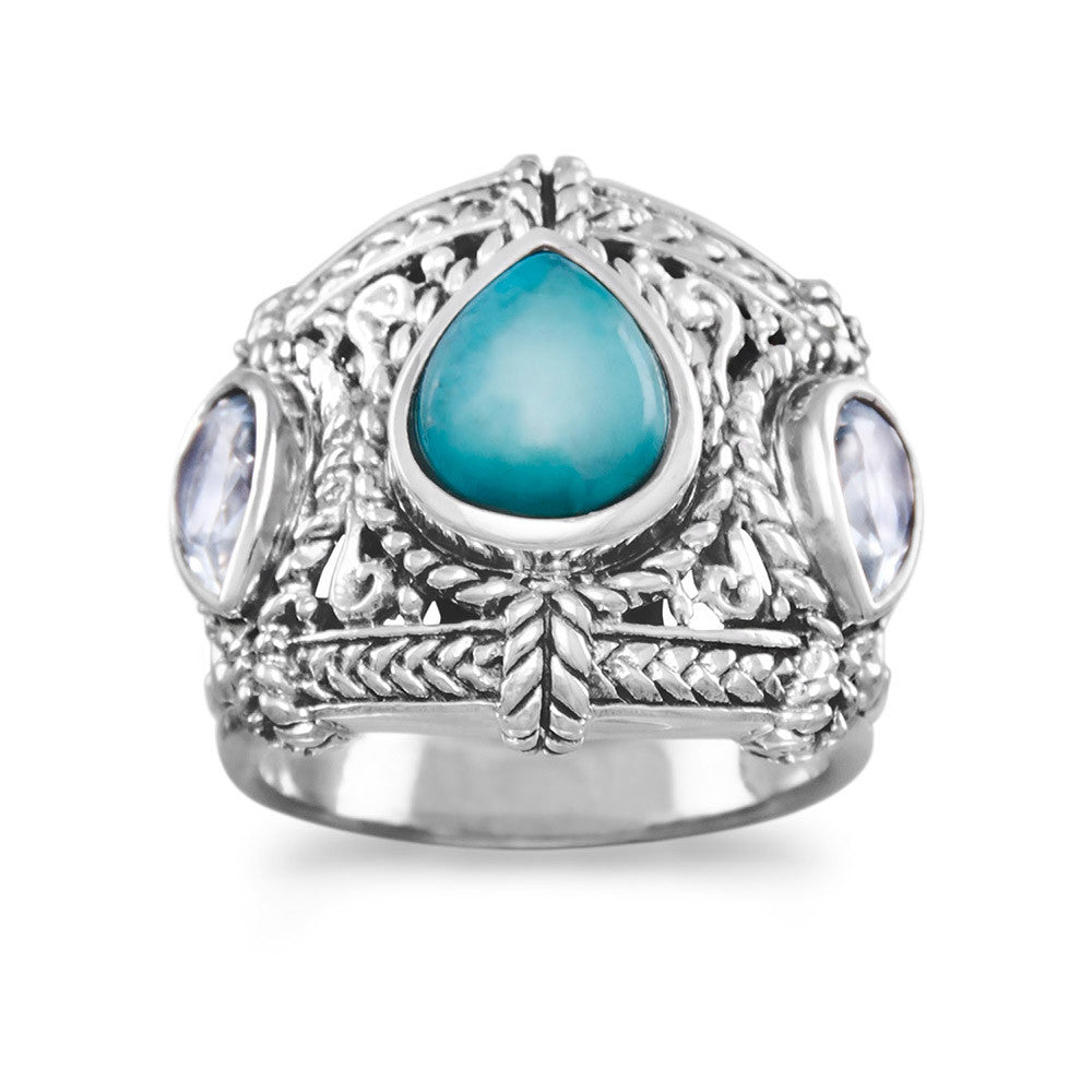 The ultimate in luxury with this stunning oxidized sterling silver ring. Featuring two dazzling 5.5mm x 8.5mm pear sky blue topaz stones and a breathtaking 8.5mm x 10.5mm pear reconstituted turquoise center stone, this piece is a true work of art. Crafted from .925 sterling silver, this ring exudes elegance and sophistication, making it the perfect addition to any jewelry collection. Available in whole sizes 6-10, this exquisite ring is sure to turn heads and elevate your style to new heights.