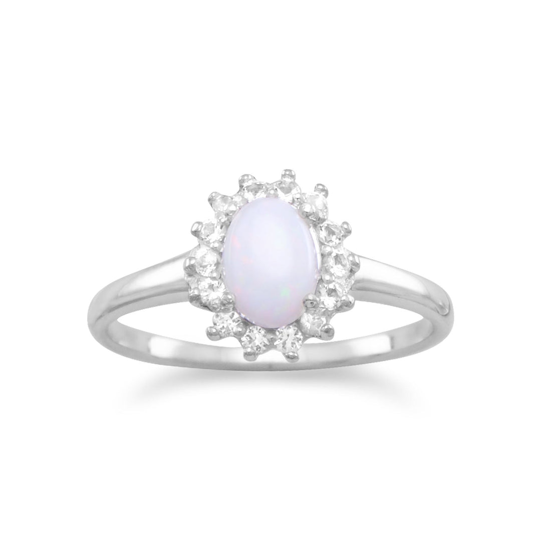 Rhodium plated sterling silver ring featuring a 5mm x 7mm genuine Australian oval opal stone with white topaz all around. The band is approximately 1.5mm. .925 Sterling Silver