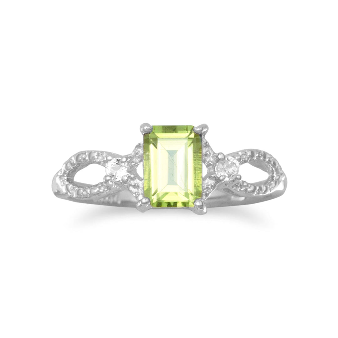 Introducing our exquisite Rhodium plated sterling silver ring, adorned with a mesmerizing 4mm x 6mm peridot. Its cut out marquise shape design, embellished with white topaz, exudes opulence. With a delicate band of approximately 1.5mm, this ring is a perfect gift for those born in August. Pair it effortlessly with any of our stunning peridot jewelry collection pieces. Crafted with .925 Sterling Silver, this luxurious ring is a true testament to elegance and sophistication.