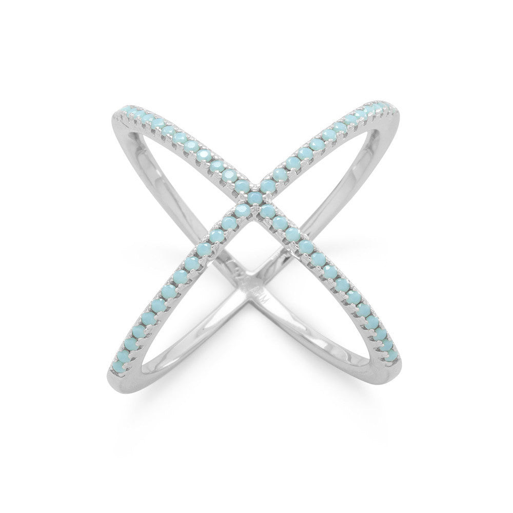 Our exquisite Rhodium plated sterling silver criss cross 'X' ring, adorned with captivating turquoise blue Cubic Zirconias. Crafted with utmost precision, this luxurious piece measures approximately 20mm, showcasing a stunning display of Cubic Zirconias on the top, while the back boasts a polished finish. Made with .925 Sterling Silver, this ring effortlessly combines elegance and sophistication, making it a must-have addition to any jewelry collection.