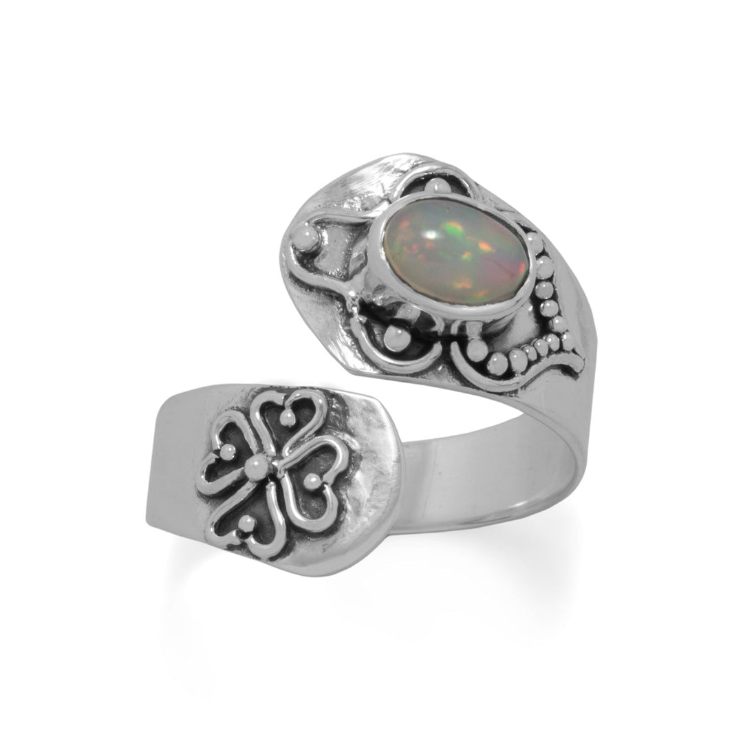 Our exquisite Oxidized Sterling Silver Spoon Ring, adorned with an intricate ornate design and showcasing a mesmerizing 5mm x 7mm white Ethiopian opal. Crafted with utmost precision, this luxurious ring is available in whole sizes 5-9 and offers a slight adjustability for a perfect fit. Meticulously crafted from .925 Sterling Silver, this piece exudes elegance and sophistication, making it a timeless addition to any jewelry collection.