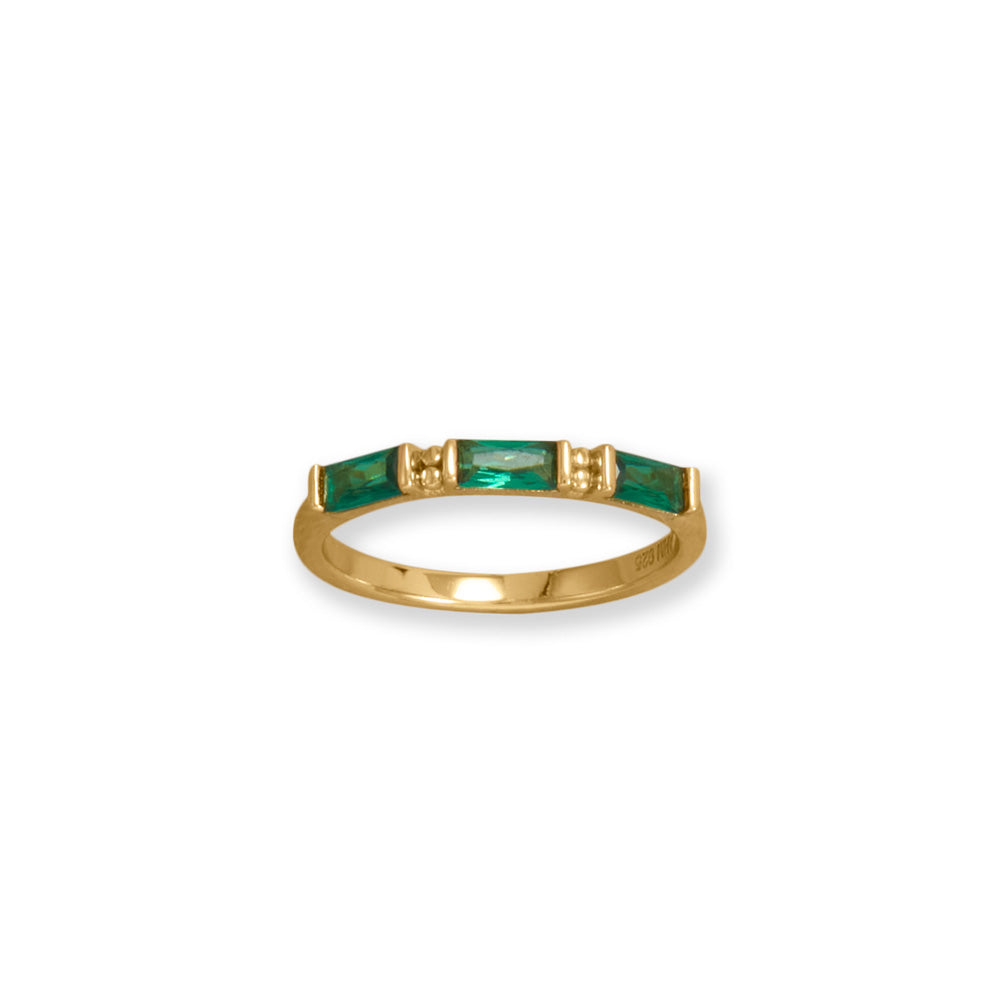 Introducing the pinnacle of elegance, the BAG ring. Meticulously handcrafted in 14 karat gold plated sterling silver, embellished with exquisite emerald green baguette cubic zirconias. This opulent 2mm wide ring emanates opulence. Effortlessly combine for a more daring aesthetic. Offered in sizes 6-9. Impeccably complements our gold and cubic zirconia assortment. Meticulously crafted with .925 Sterling Silver. Pro tip: Mix and match or layer our baguette collection for a BOLDER look!