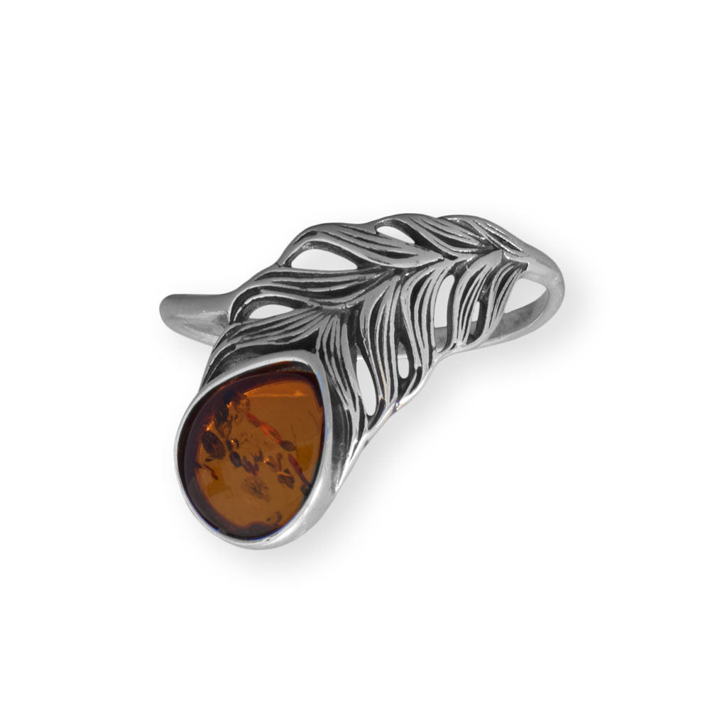 Experience the epitome of opulence with our exquisite oxidized sterling silver feather ring. Embellished with a genuine 8.5mm x 7.5mm Baltic amber from Poland, this masterpiece boasts a 1.5mm wide band crafted from .925 sterling silver. Elevate your style by pairing it with our Baltic Amber jewelry collection. Available in whole sizes 6-10, this ring is a testament to the unparalleled allure and magnificence of Baltic Amber.