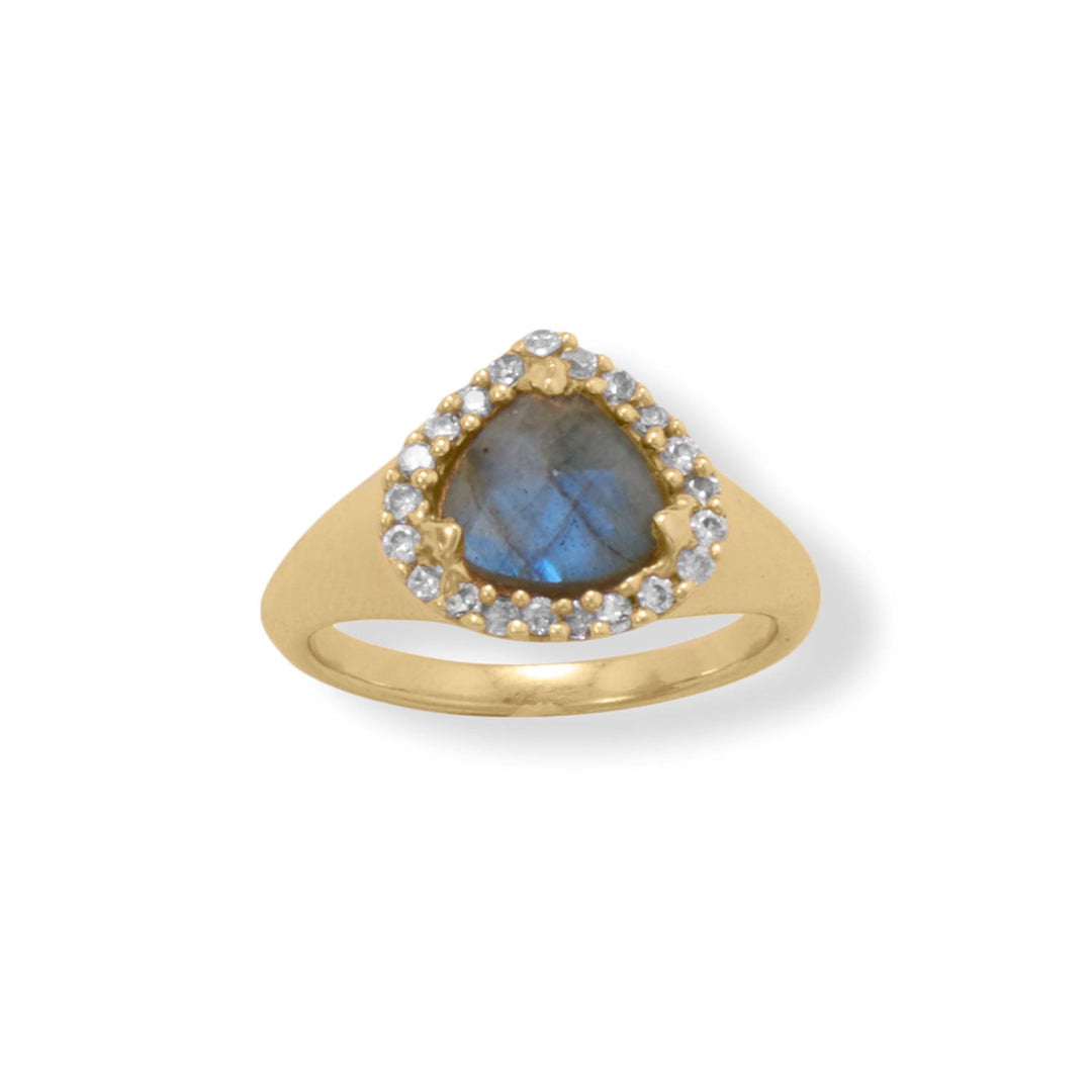 Indulge in opulence with this stunning ring. The 14 karat gold plated sterling silver band tapers from 6mm-2mm, showcasing an exquisite 8mm pear labradorite stone encircled by a 2mm round cubic zirconia halo. Crafted from .925 sterling silver, this piece is available in whole sizes 6-9. Perfect for a loved one, it pairs effortlessly with our gold and labradorite collection, creating a cohesive and stylish look that will steal the spotlight.