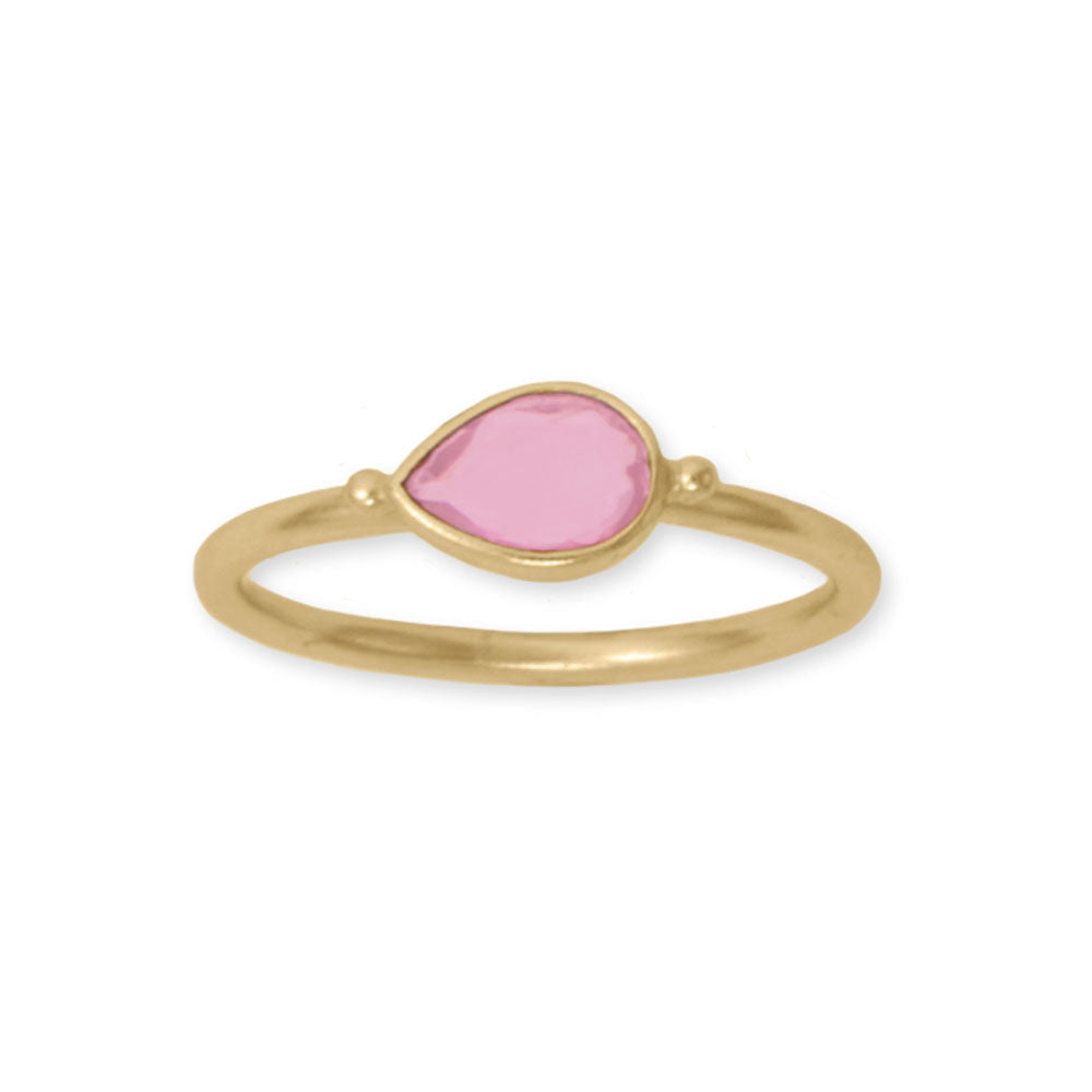 Indulge in opulence with our 14k gold plated sterling silver ring, adorned with a stunning 7.5mm x 5.5mm pear-shaped pink glass. Stackable and chic, this piece is available in whole sizes 6-9. Mix and match with our pink glass and gold collection for a bold and luxurious statement. Crafted from .925 sterling silver, this ring is a true treasure.