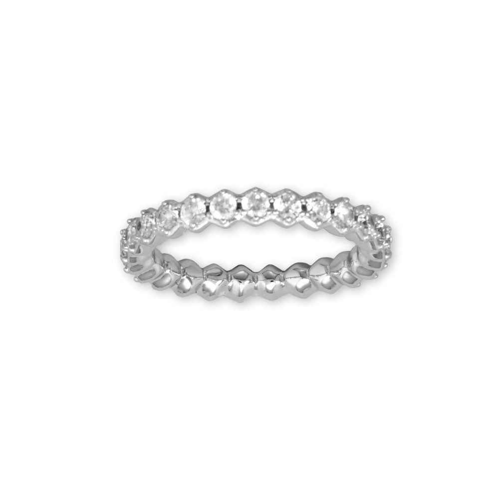 Introducing our exquisite Rhodium plated eternity ring, a true symbol of elegance and sophistication. Crafted with hexagonal shape settings and adorned with dazzling 2.5mm round cubic zirconias, this ring is a timeless beauty. With a band width of 3.6mm, it offers a comfortable fit. Available in whole sizes 6-9. Made with .925 Sterling Silver.