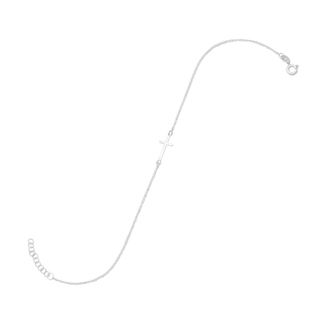 Introducing our exquisite 9" + 1" extension sterling silver anklet, adorned with a polished 8mm x 14mm sideways cross. Crafted from premium quality .925 sterling silver, this anklet is a true testament to the art of fine jewelry making. The sideways cross, a symbol of faith and spirituality, adds a touch of elegance and sophistication to this already stunning piece. The anklet is secured with a spring ring closure, ensuring a comfortable and secure fit.