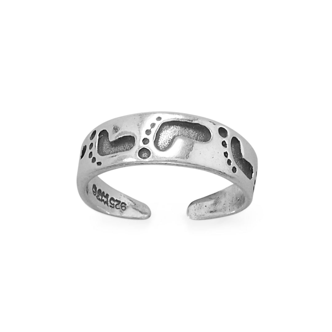 Complete your seaside look with our exquisite oxidized sterling silver toe ring. Its beauty and elegance will captivate you, while its open design ensures a perfect fit. Crafted from .925 sterling silver, it's a must-have accessory. Inspired by "Footprints in the Sand," it connects you to your spirituality. Don't miss out on the opportunity to make a statement with this stunning piece of jewelry and leave your footprints in the sand.