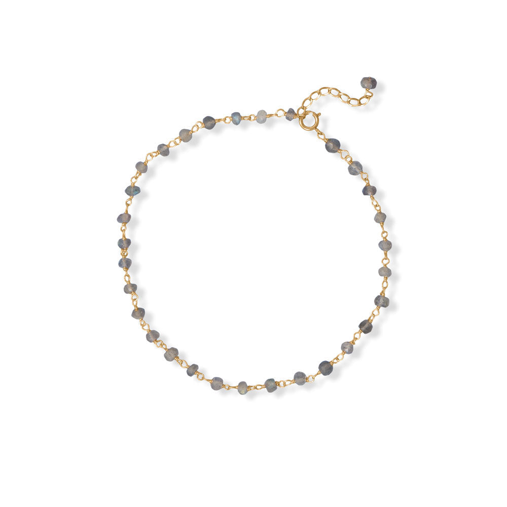 Introducing our exquisite 14k gold plated sterling silver hand beaded chain, adorned with mesmerizing 3mm x 4mm labradorite beads. The spring ring closure ensures both safety and security. This anklet measures 9.5" with a 1" extension, crafted from .925 Sterling Silver. Pair it with our other labradorite beaded jewelry pieces for a truly luxurious ensemble.